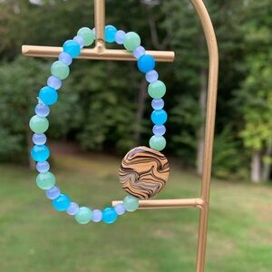 Blue And Light Green Handmade Bracelet With A Tan Accent Bead🩵
